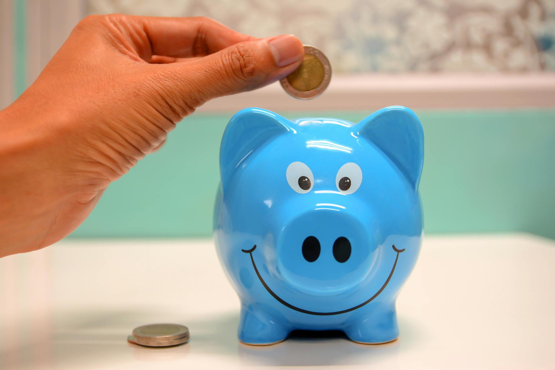 A piggy bank with coins, symbolizing savings from a good loan.
